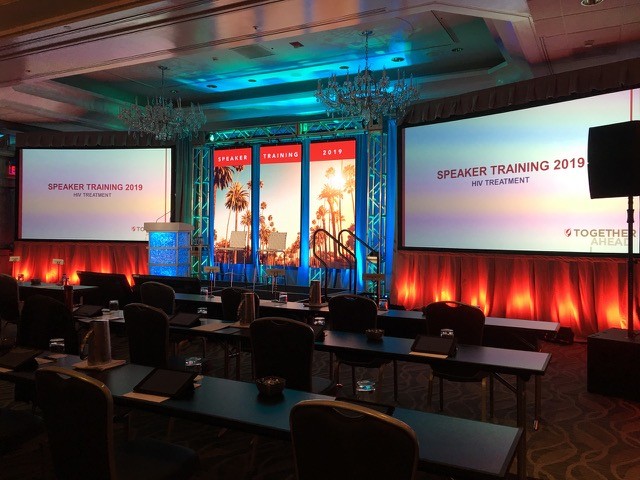 Truss backdrop with lit podium